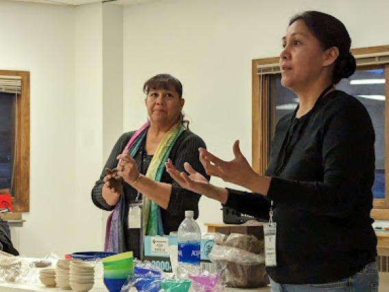 Shaleene Chavarria and her mother Vickie Martinez leading a workshop on Santa Clara pottery