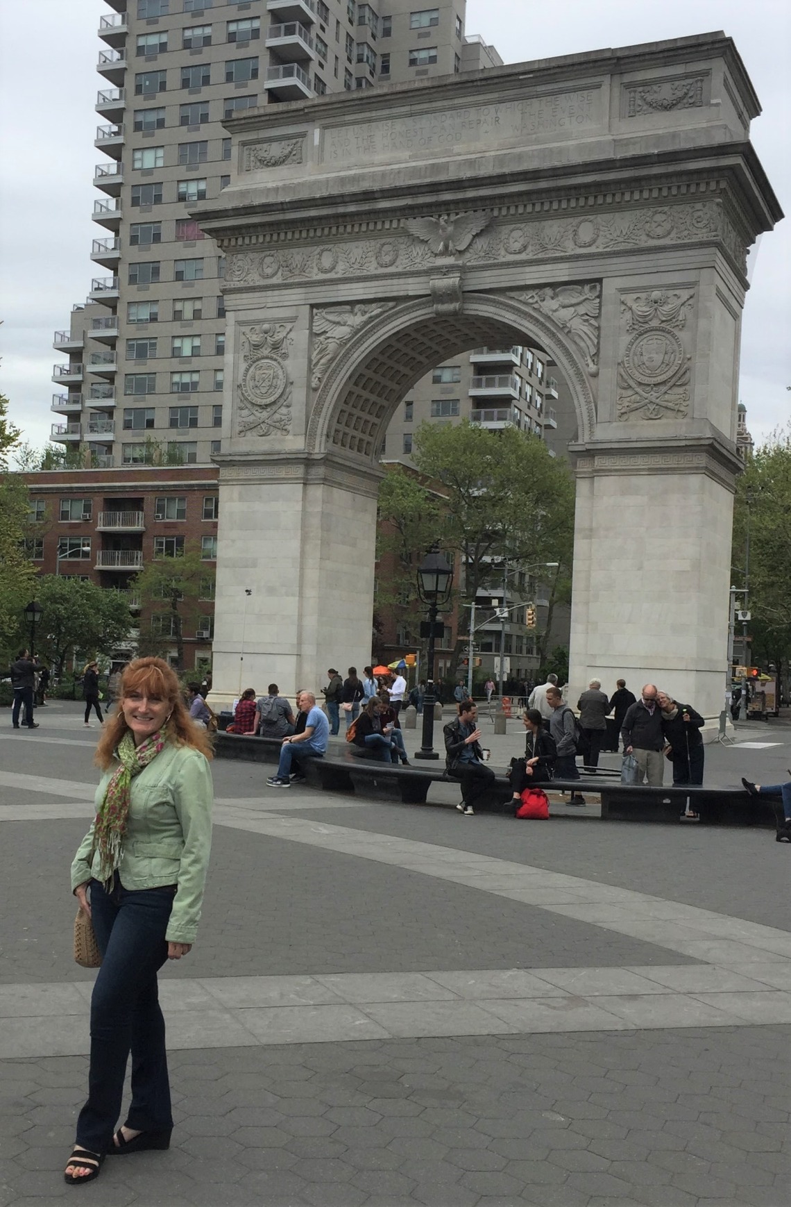 Corrina pictured in front of archway in New York City 